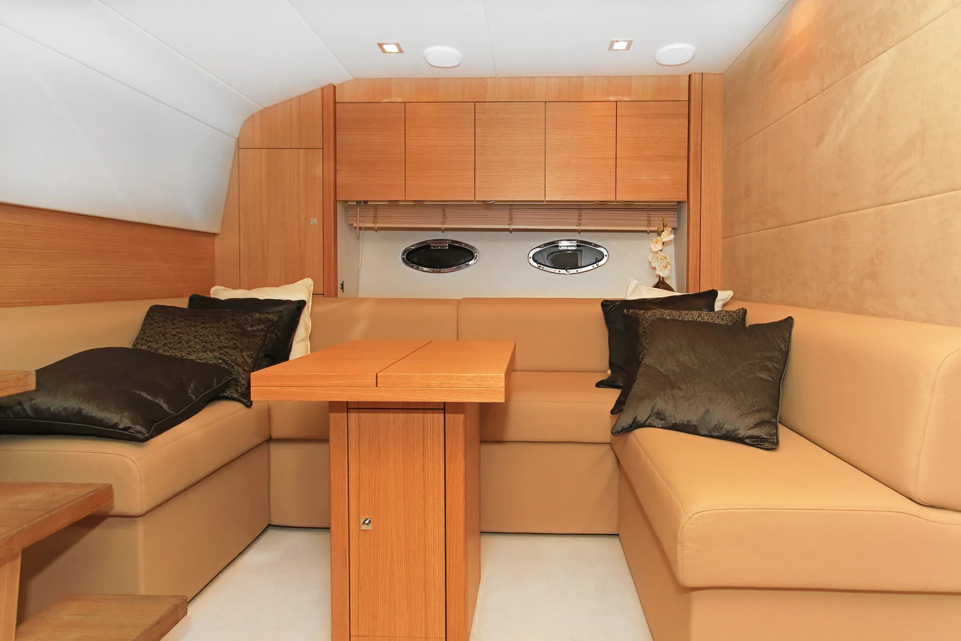 Custom wood cabinetry and furniture inside a yacht salon