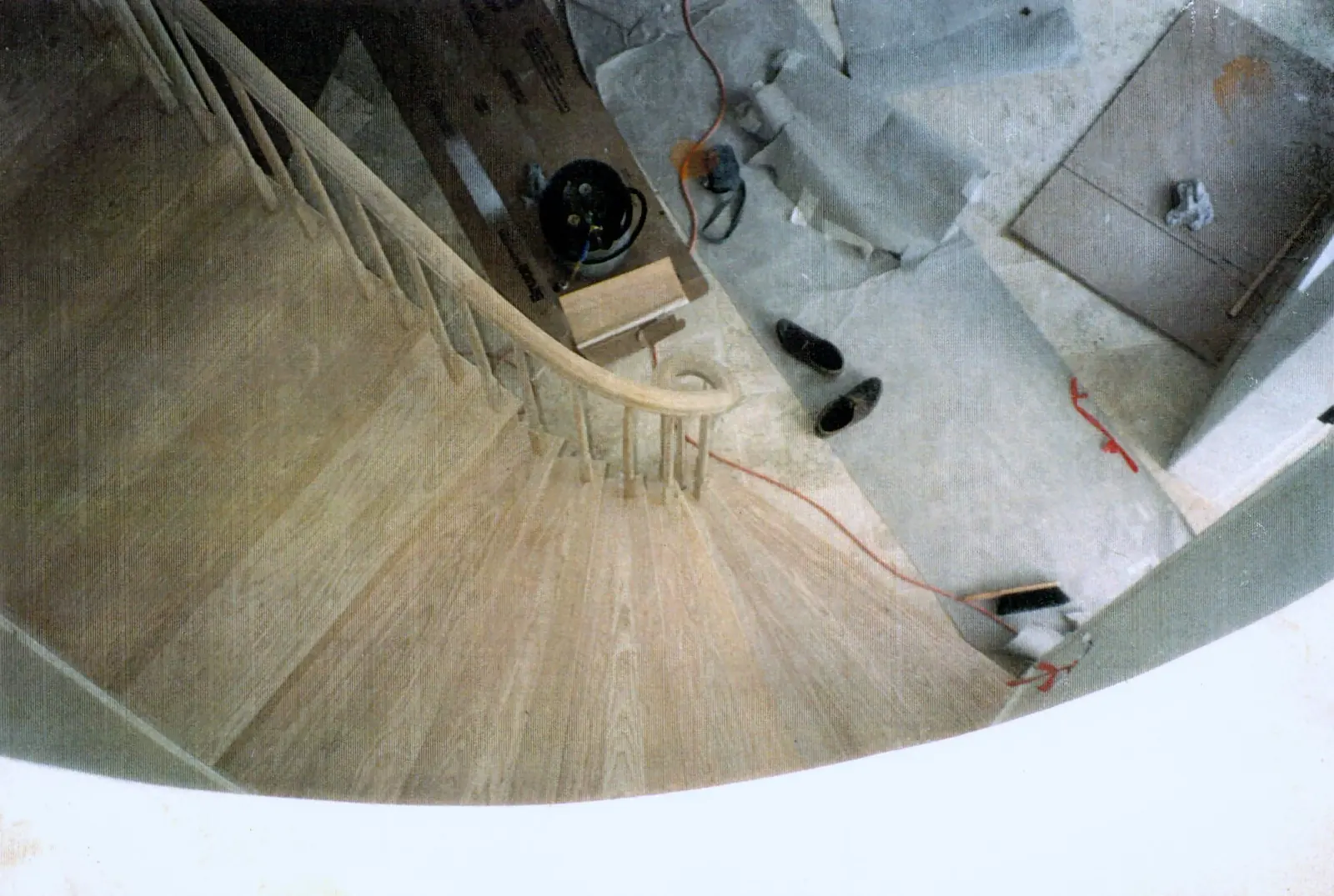 Overhead view of a completed curved wood spiral staircase