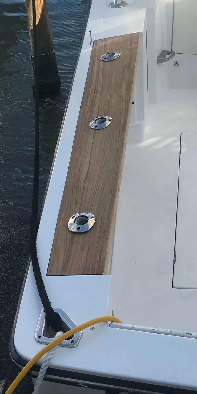 New teak covering board installed with flush deck hardware