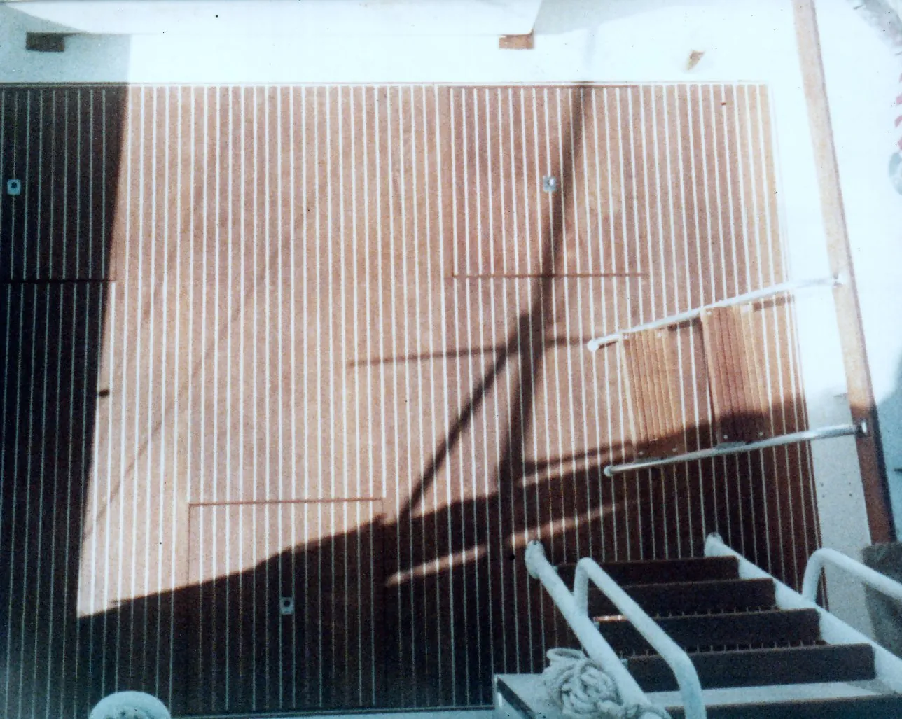 Finished teak cockpit deck with curved wood combing
