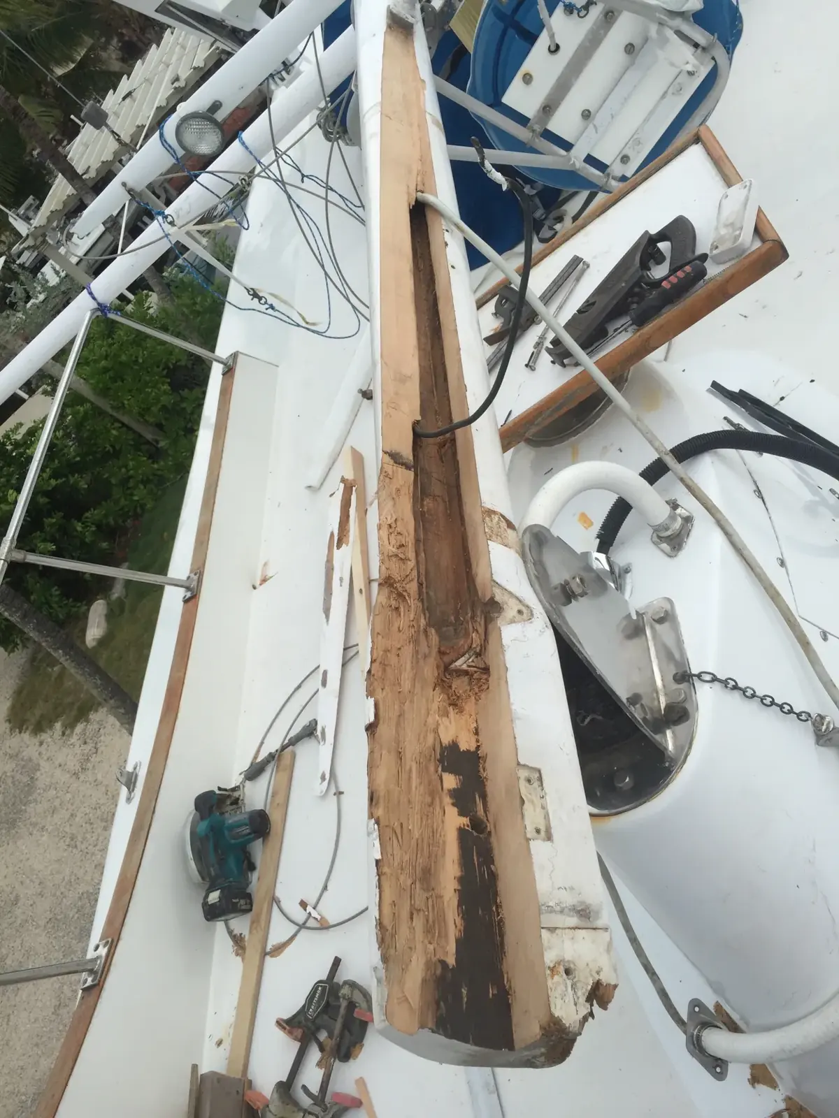 Rot exposed in a trawler's steadying-sail mast before repair