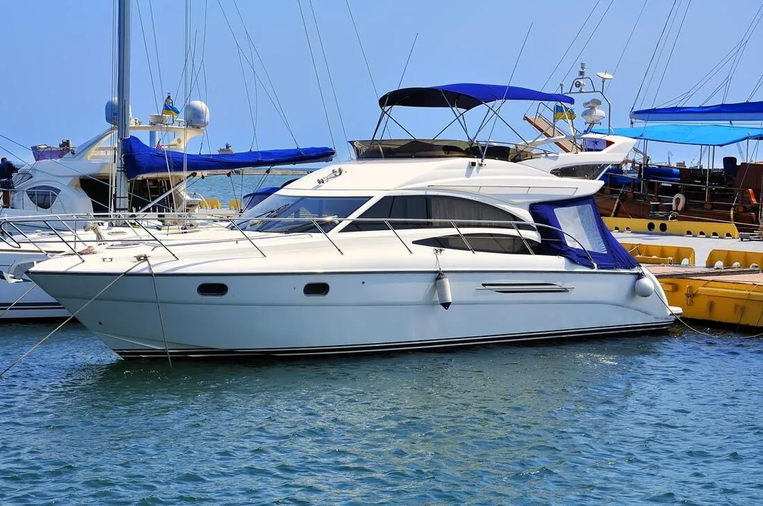 White motor yacht docked at a Florida Keys marina