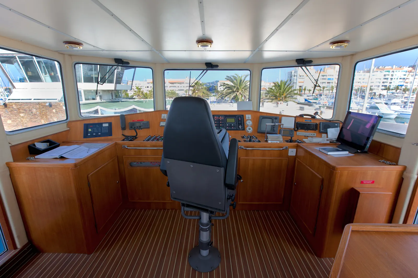 Yacht bridge with a custom wood console and cabinetry